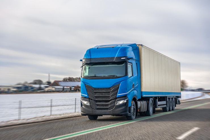 blue-semi-truck-with-trailer-winter-road-international-freight-transport_169016-71605