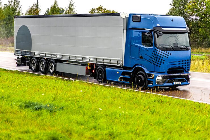modern-blue-truck-wet-highway-power-reliability-motion_169016-69836